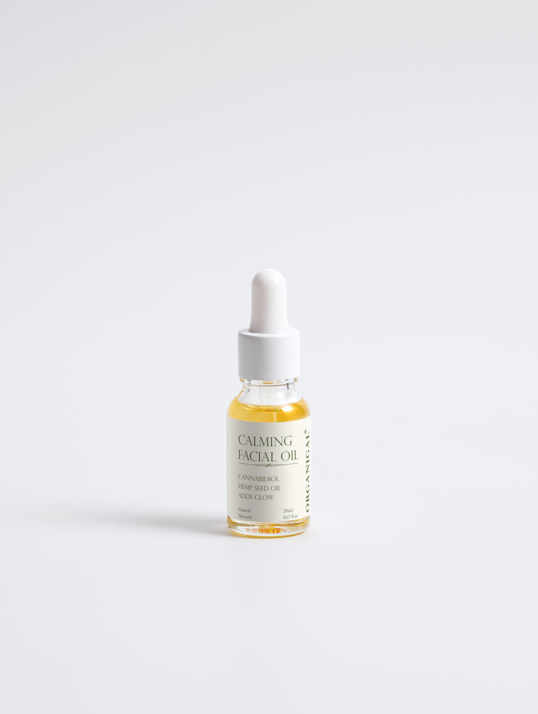 Styled image of Organigal Calming CBD Facial Oil – natural booster for calm, glowing skin bottle