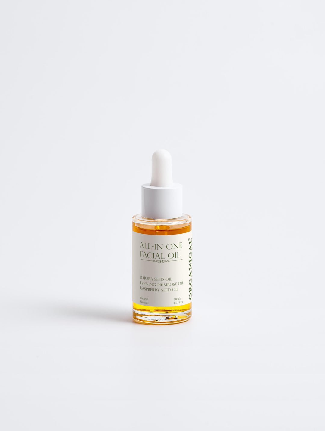 Close-up of the golden oil texture from Organigal’s All-In-One Facial Oil with dropper